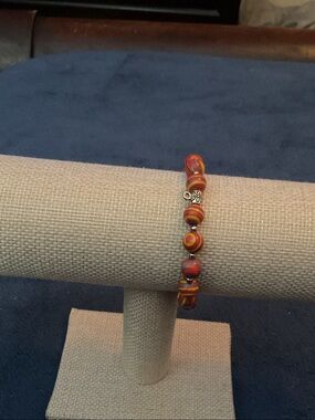 Handmade Orange Swirl Beaded Bracelet with Silver Accent